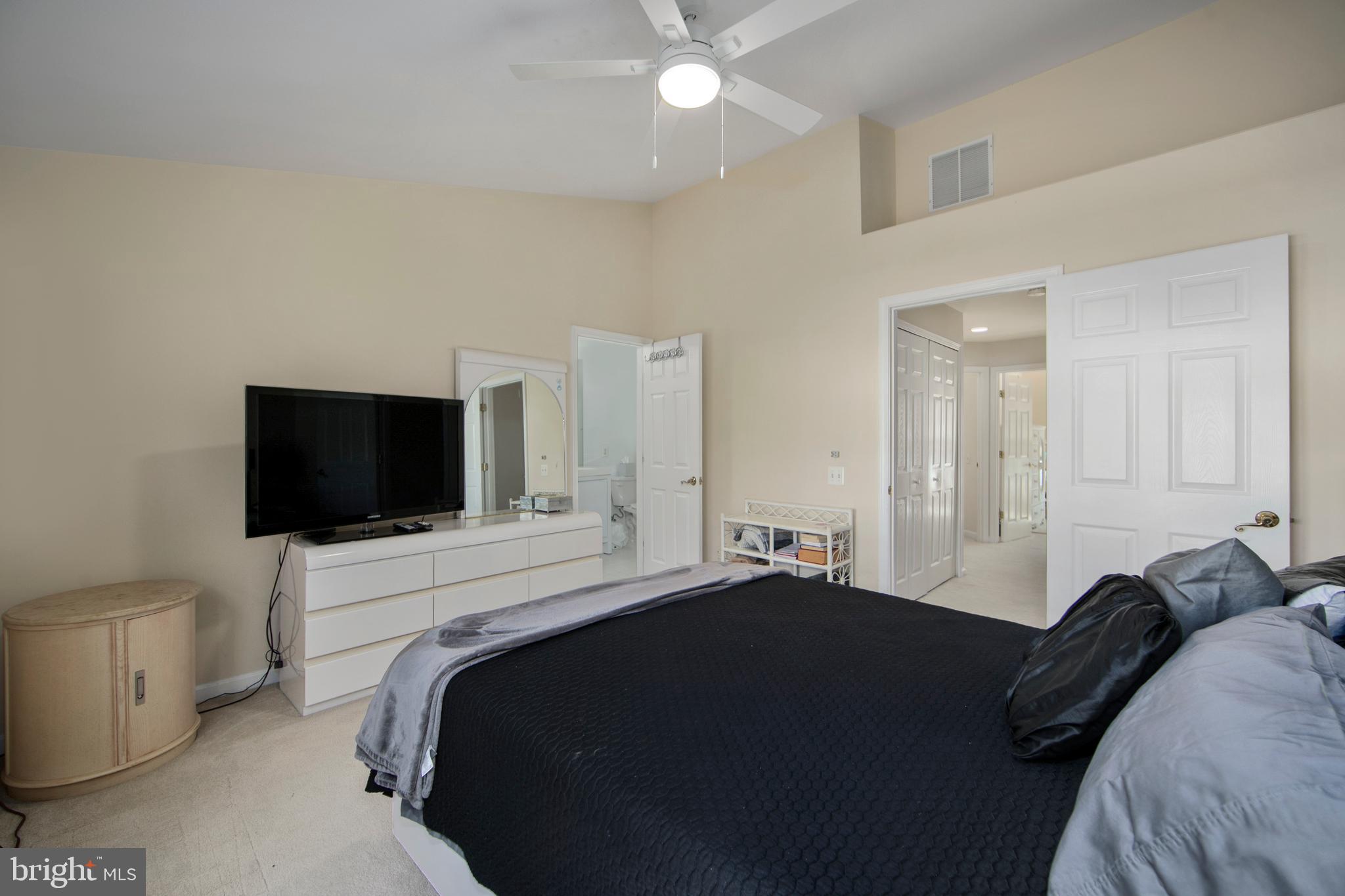 27 Firethorn Lane Riverside, NJ 08075 - Photo 23 of 43 a bedroom with a bed and a flat screen tv