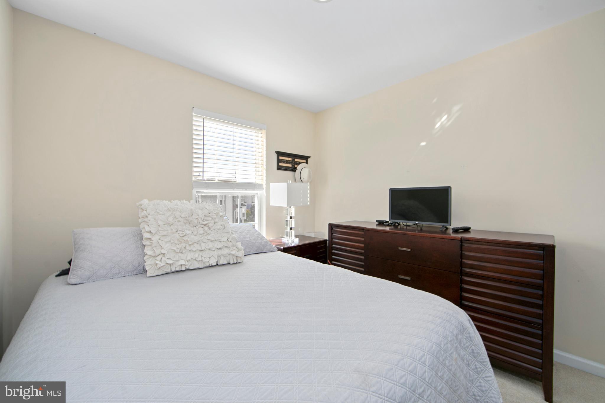 27 Firethorn Lane Riverside, NJ 08075 - Photo 29 of 43 a bedroom with a bed and a television
