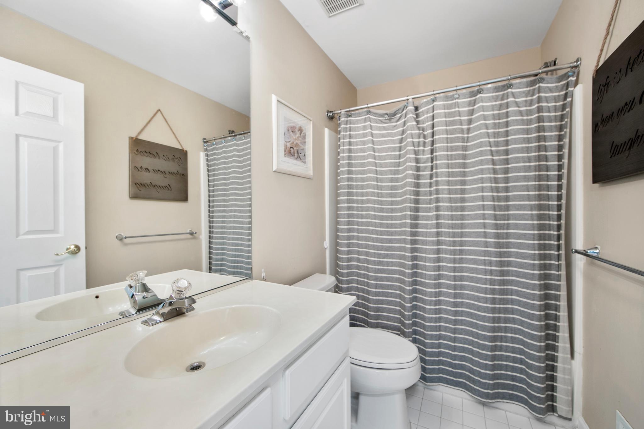 27 Firethorn Lane Riverside, NJ 08075 - Photo 31 of 43 a bathroom with a sink a toilet and mirror