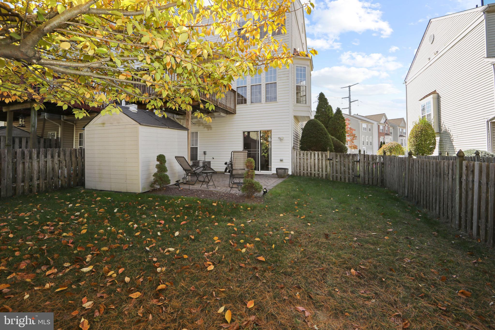 27 Firethorn Lane Riverside, NJ 08075 - Photo 33 of 43 a backyard of a house with table and chairs