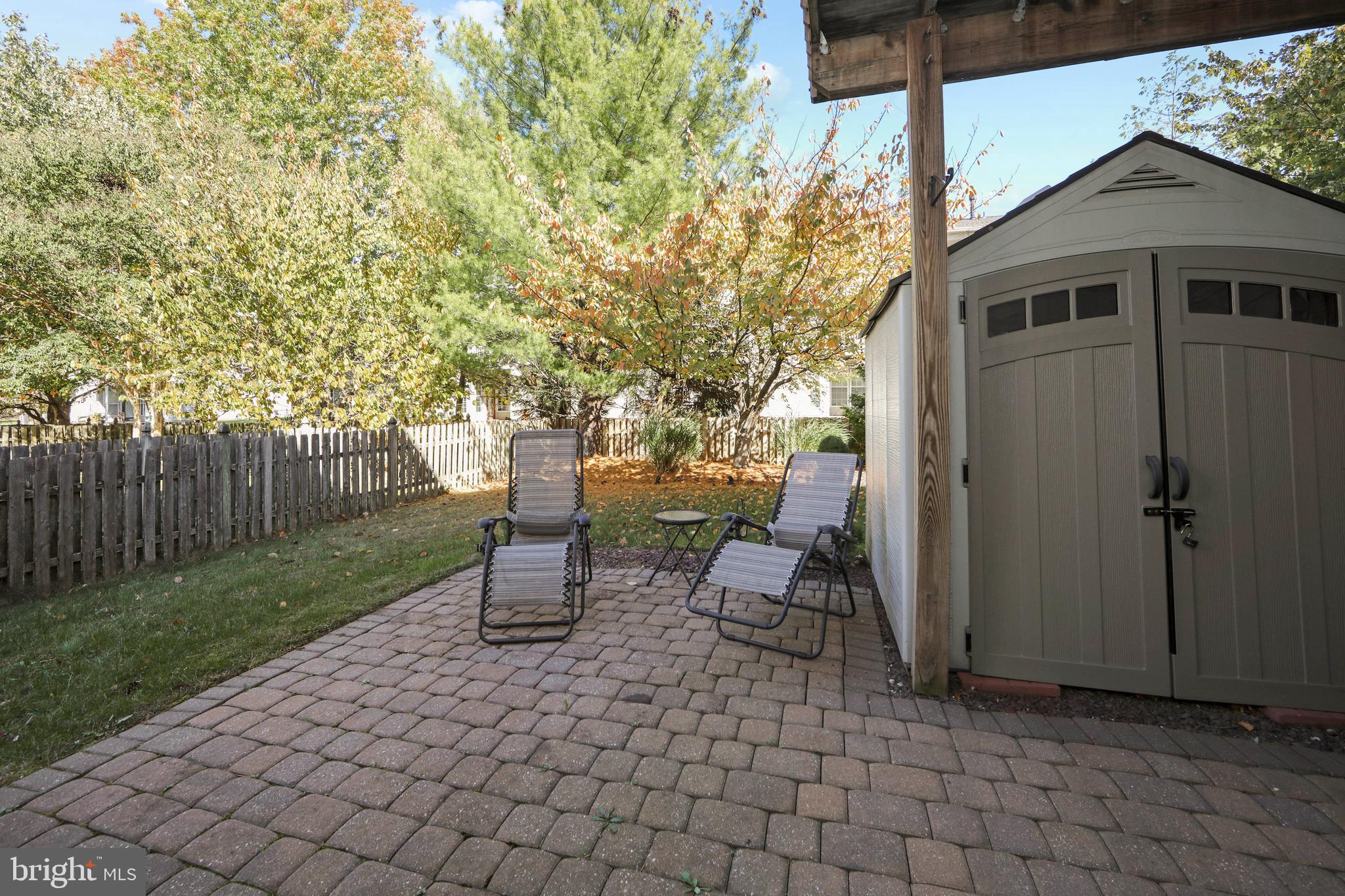 27 Firethorn Lane Riverside, NJ 08075 - Photo 38 of 43 a view of a patio with table and chairs and wooden fence