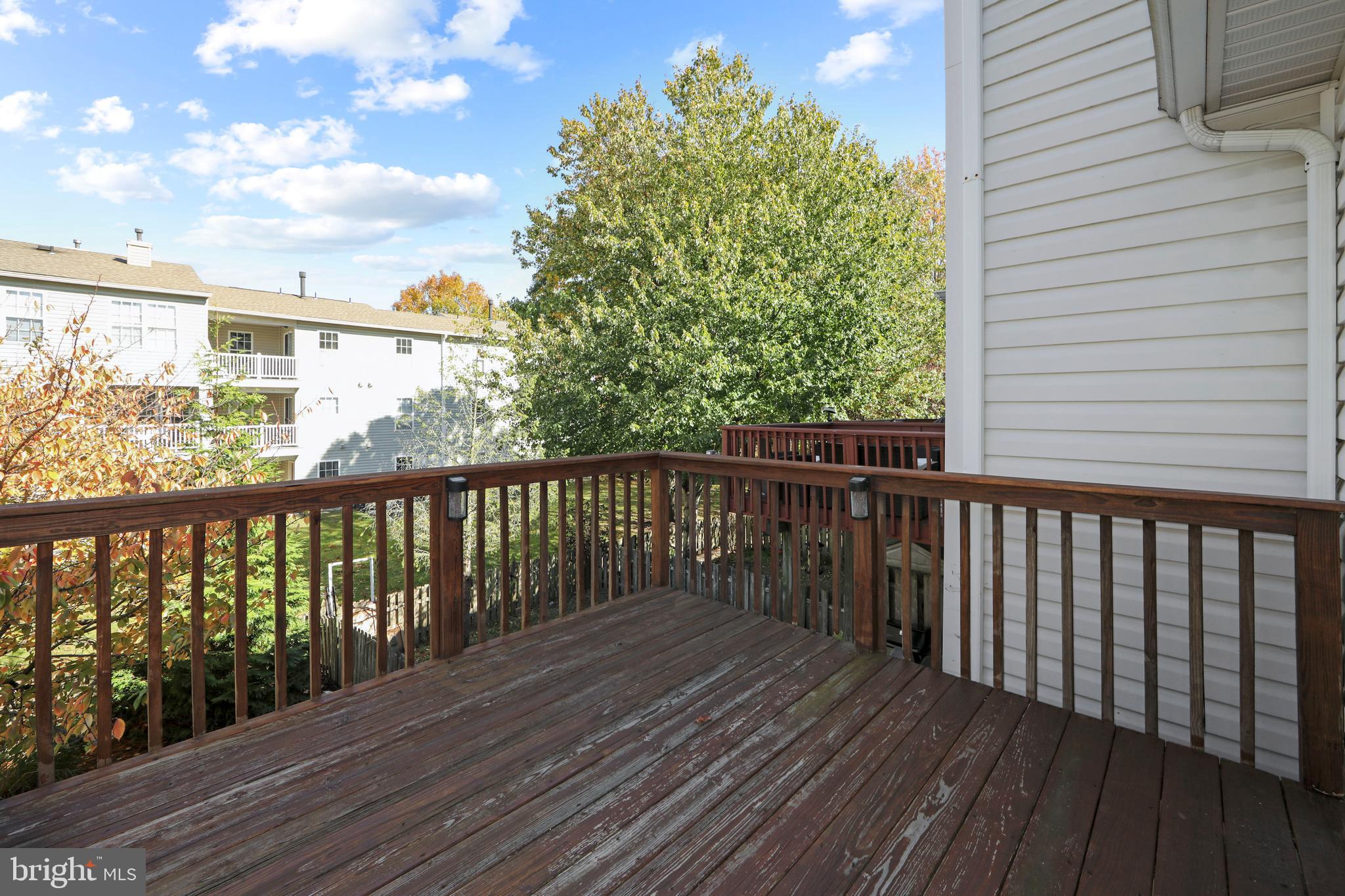 27 Firethorn Lane Riverside, NJ 08075 - Photo 40 of 43 a balcony with wooden floor and fence