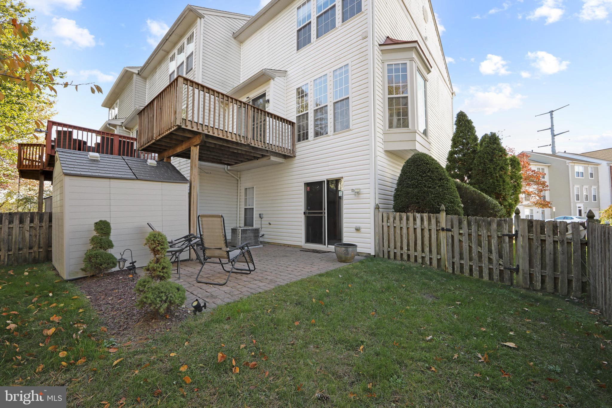 27 Firethorn Lane Riverside, NJ 08075 - Photo 7 of 43 a view of a chair and table in backyard
