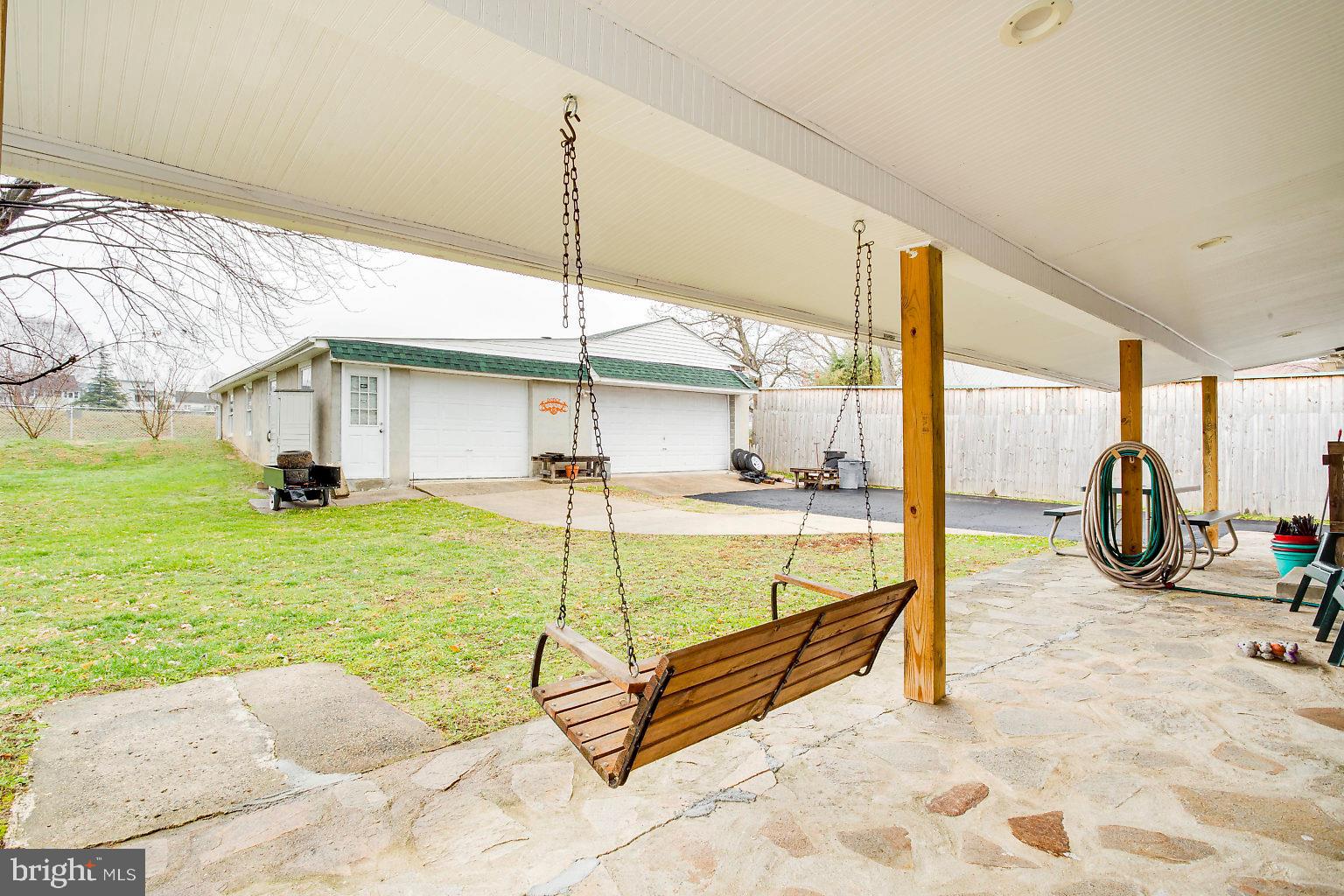 1248 Sulphur Spring Road Baltimore, MD 21227 - Photo 8 of 28 Large covered patio with stone pavers.