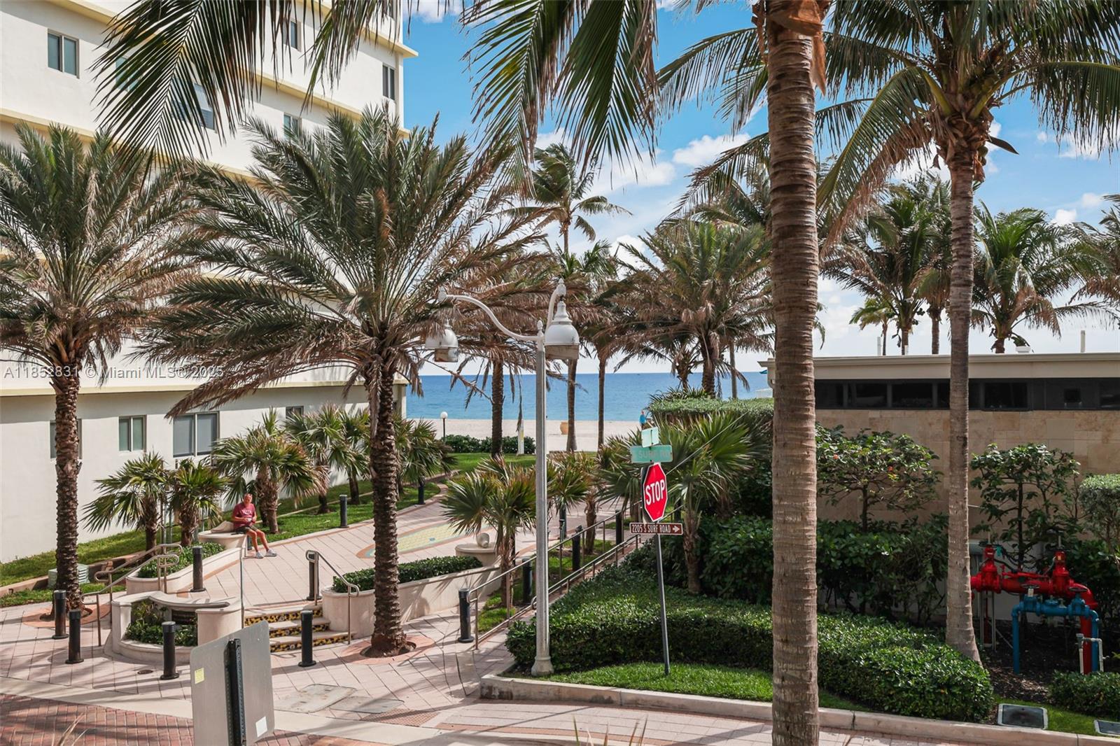2101 South Surf Road, Unit 2F Hollywood, FL 33019 - Photo 33 of 70 a front view of multi story residential apartment building with yard and green space