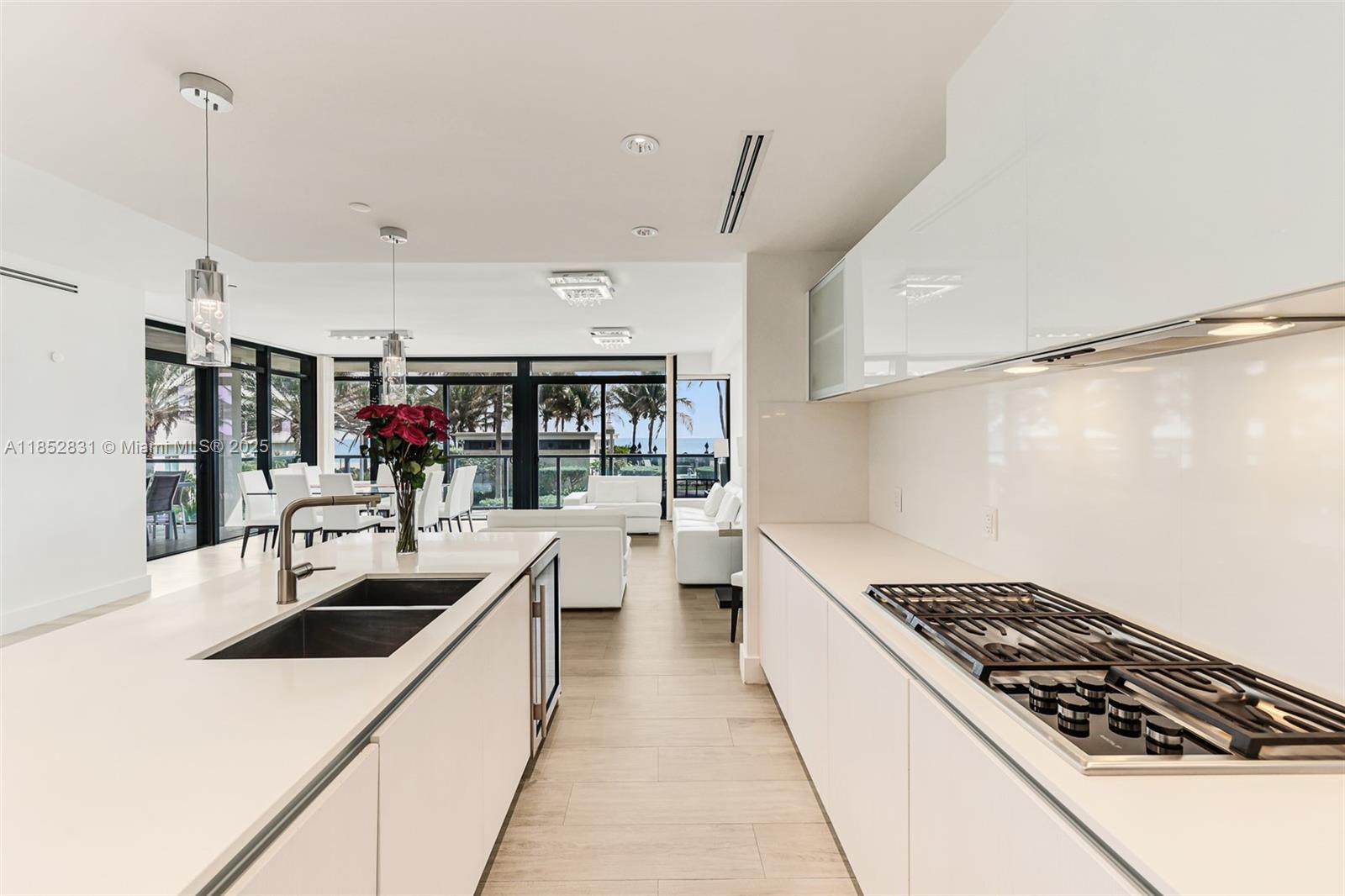 2101 South Surf Road, Unit 2F Hollywood, FL 33019 - Photo 49 of 70 a kitchen with stove a sink and cabinets