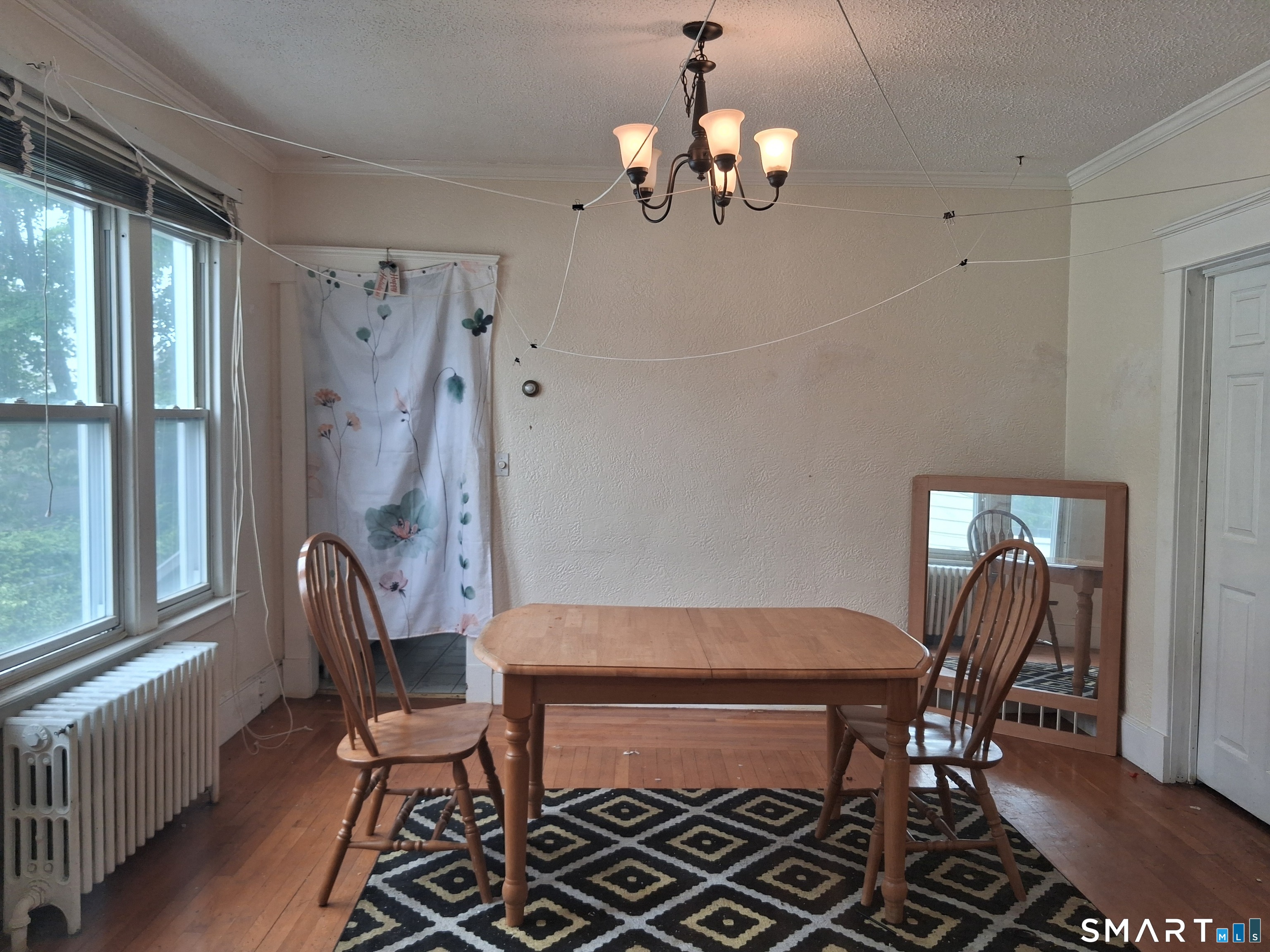 26 4th Street Hamden, CT 06514 - Photo 39 of 40 a view of a dining room with furniture and chandelier