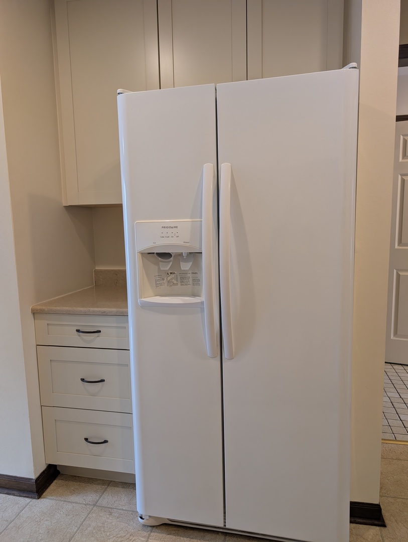 1535 Wedgefield Circle, Unit 1535 Naperville, IL 60563 - Photo 13 of 46 a walk in closet with white cabinets