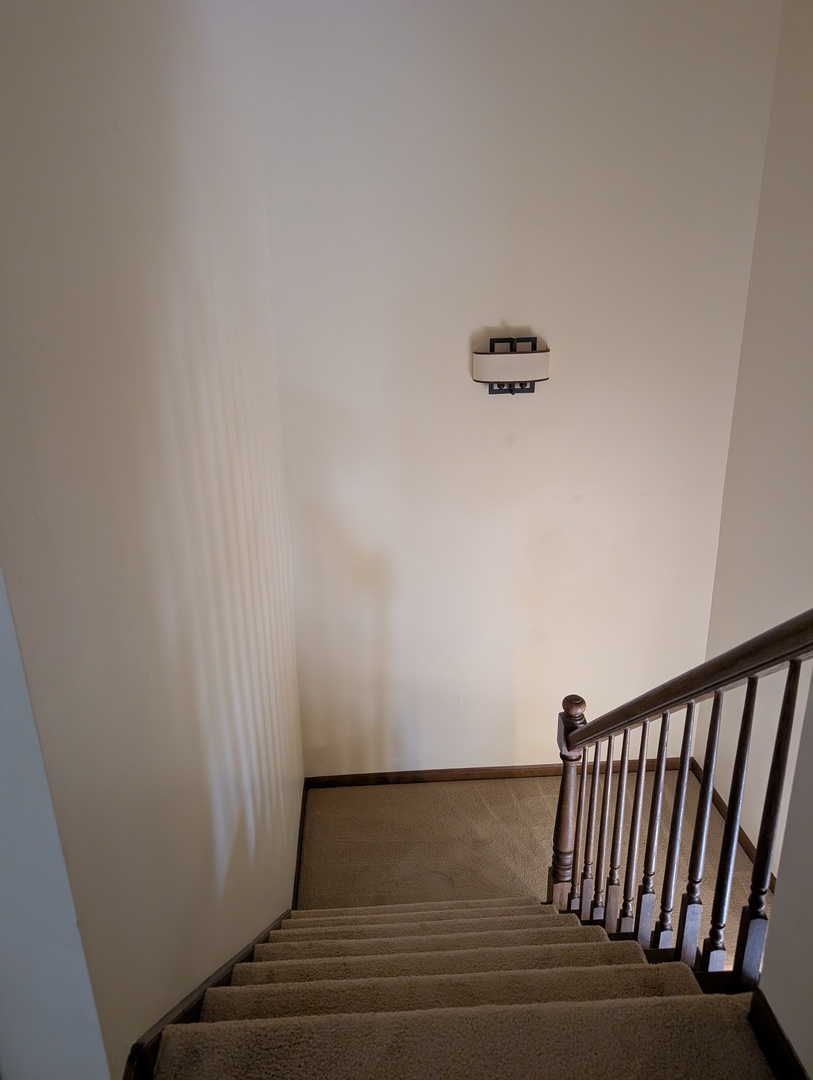 1535 Wedgefield Circle, Unit 1535 Naperville, IL 60563 - Photo 20 of 46 a view of staircase with white walls