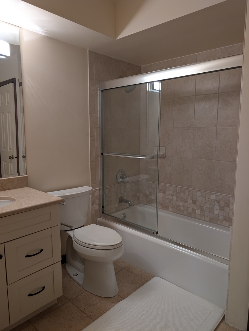 1535 Wedgefield Circle, Unit 1535 Naperville, IL 60563 - Photo 24 of 46 a bathroom with a shower a toilet and a sink