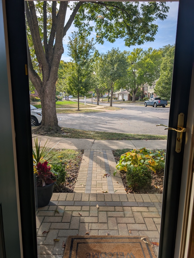 1535 Wedgefield Circle, Unit 1535 Naperville, IL 60563 - Photo 5 of 46 a view of a yard with an outdoor space