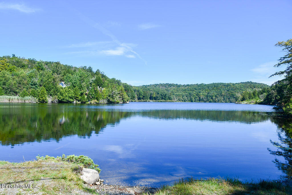 2000 West Center Road Otis, MA 01253 - Photo 3 of 3 a view of a lake with a house in the background