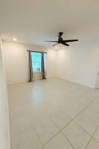 an empty room with windows and entrance