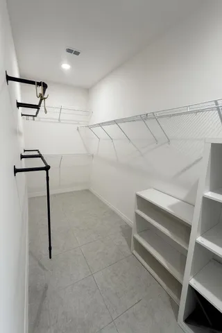 a view of hallway with stairs and wooden floor