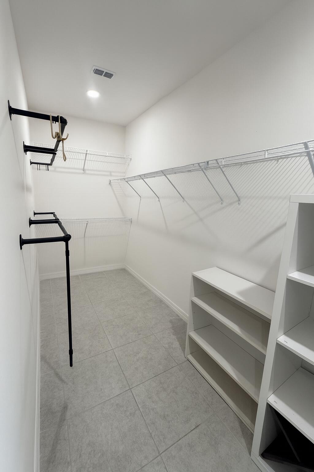 1963 Southwest Import Drive Port St. Lucie, FL 34953 - Photo 16 of 39 a view of storage and utility room with racks on the wall