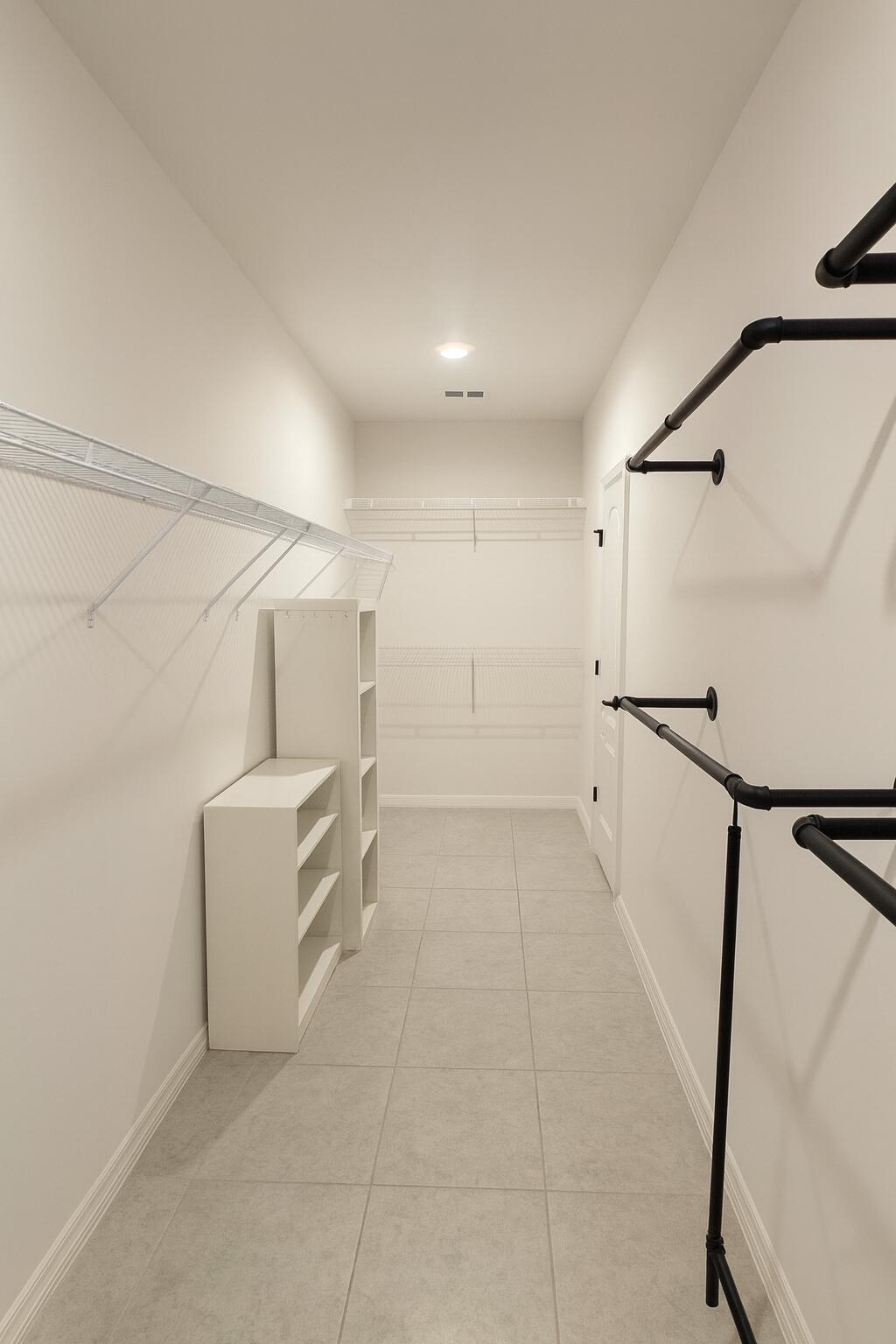 1963 Southwest Import Drive Port St. Lucie, FL 34953 - Photo 17 of 39 a view of hallway with stairs and wooden floor