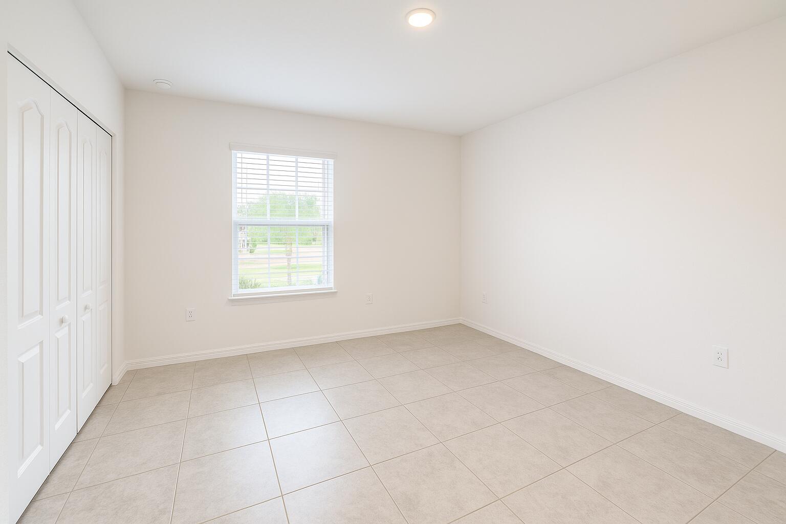 1963 Southwest Import Drive Port St. Lucie, FL 34953 - Photo 21 of 39 an empty room with a window