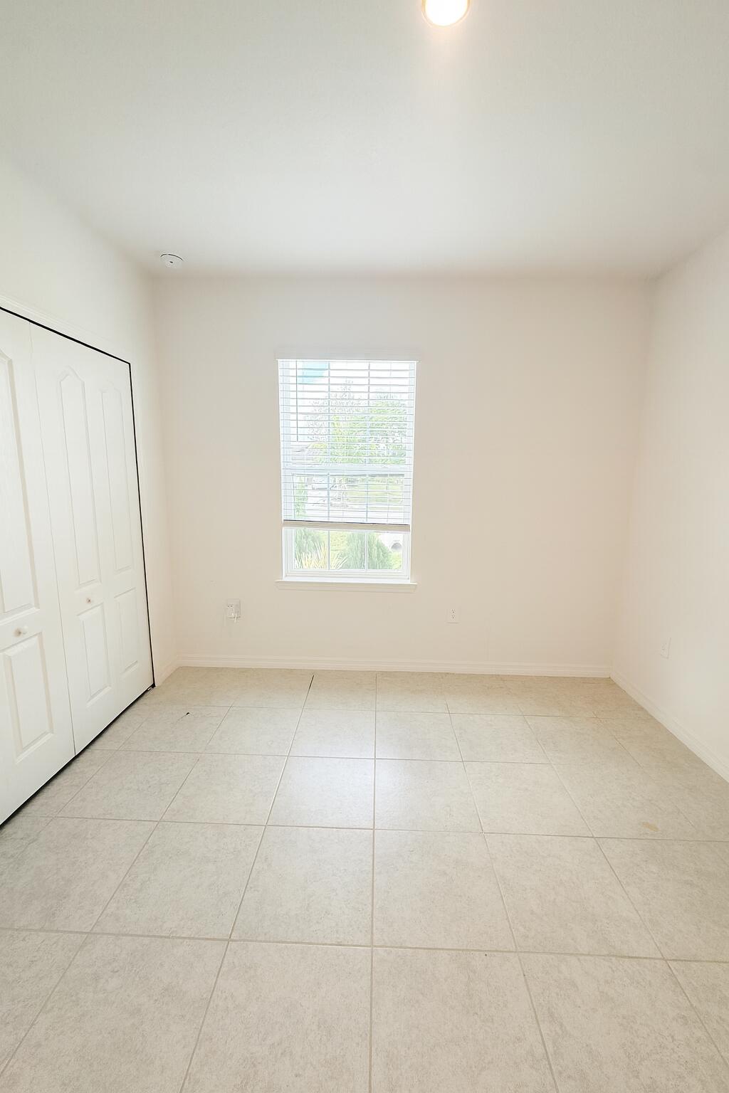 1963 Southwest Import Drive Port St. Lucie, FL 34953 - Photo 22 of 39 an empty room with a window
