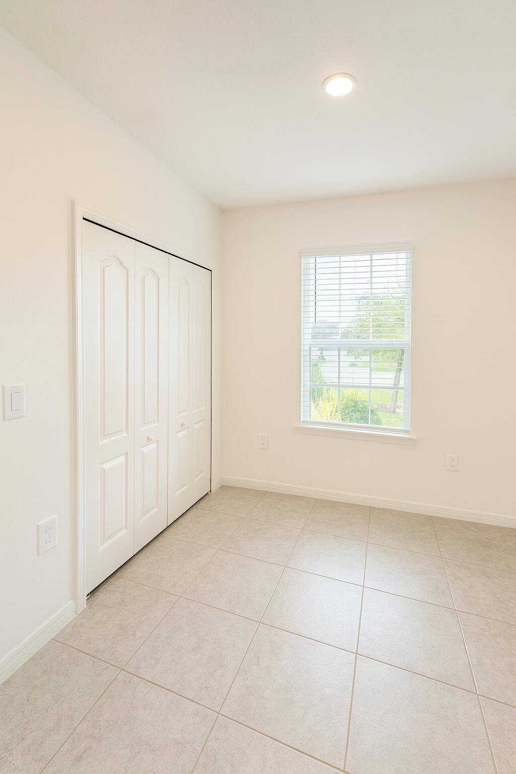 1963 Southwest Import Drive Port St. Lucie, FL 34953 - Photo 23 of 39 an empty room with windows
