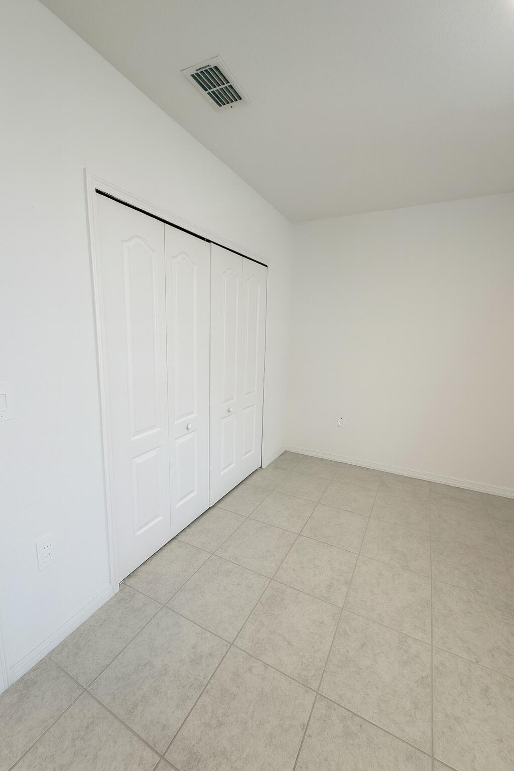 1963 Southwest Import Drive Port St. Lucie, FL 34953 - Photo 25 of 39 a view of an empty room