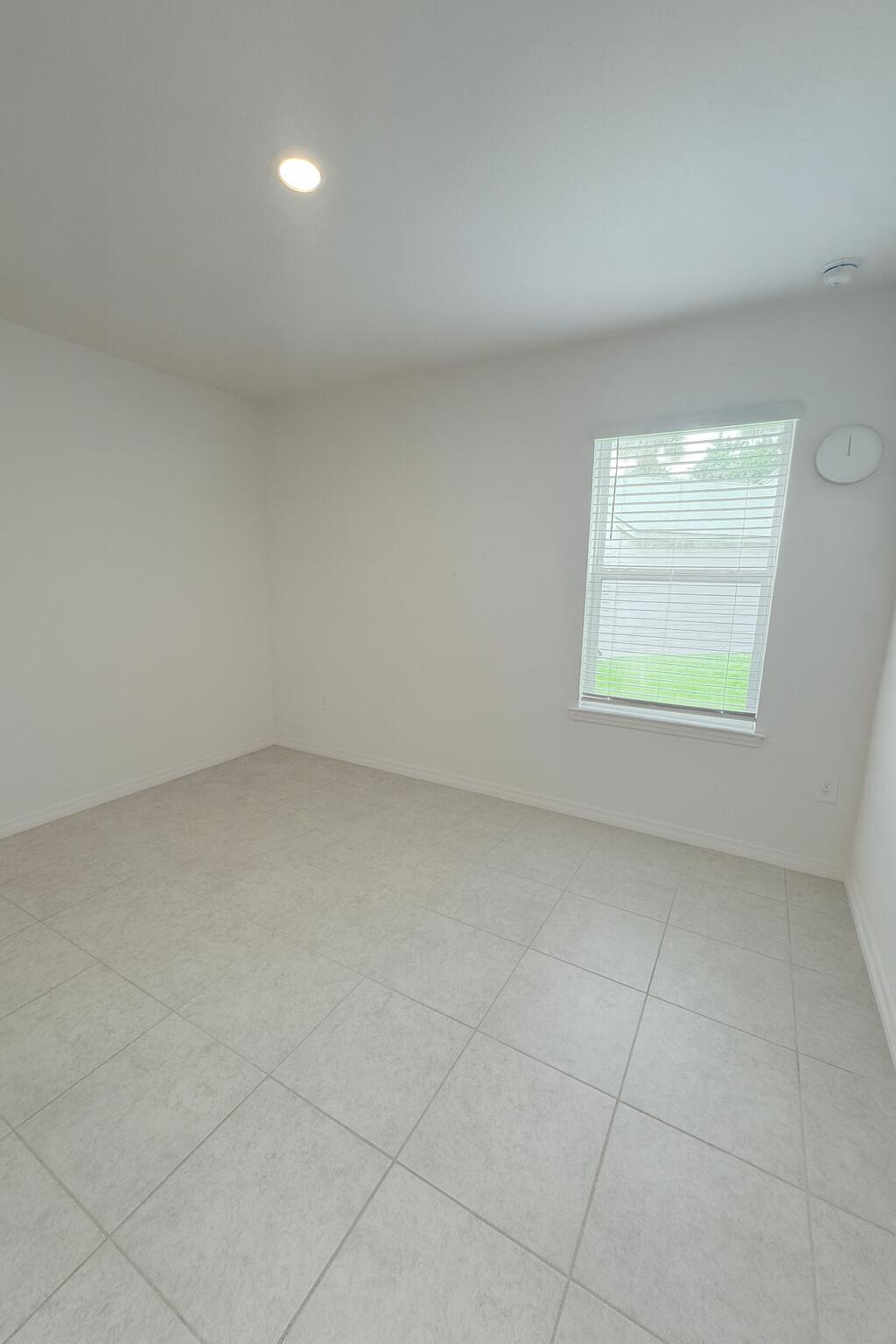 1963 Southwest Import Drive Port St. Lucie, FL 34953 - Photo 26 of 39 an empty room with a window