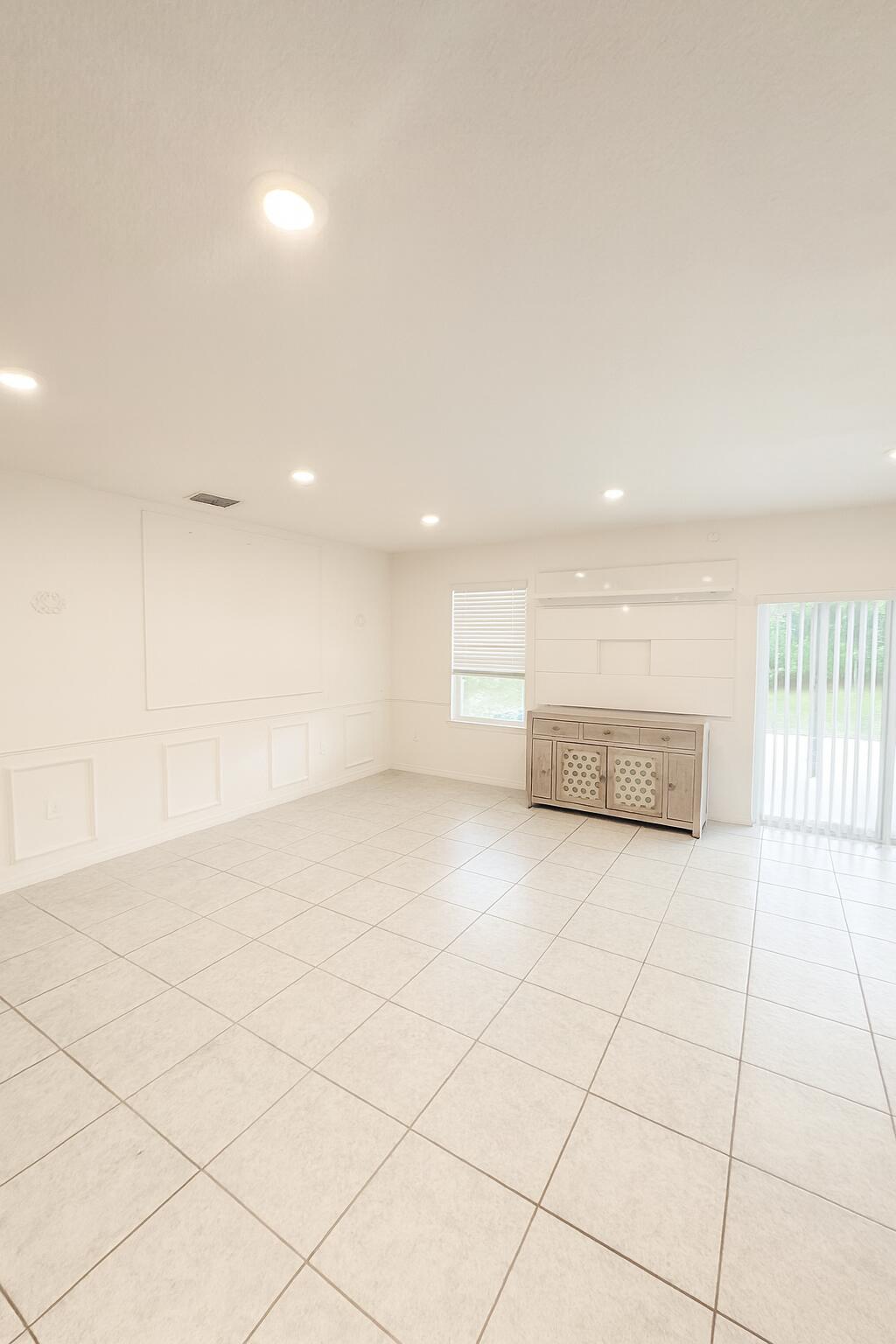 1963 Southwest Import Drive Port St. Lucie, FL 34953 - Photo 33 of 39 wooden floor in an empty room with a window