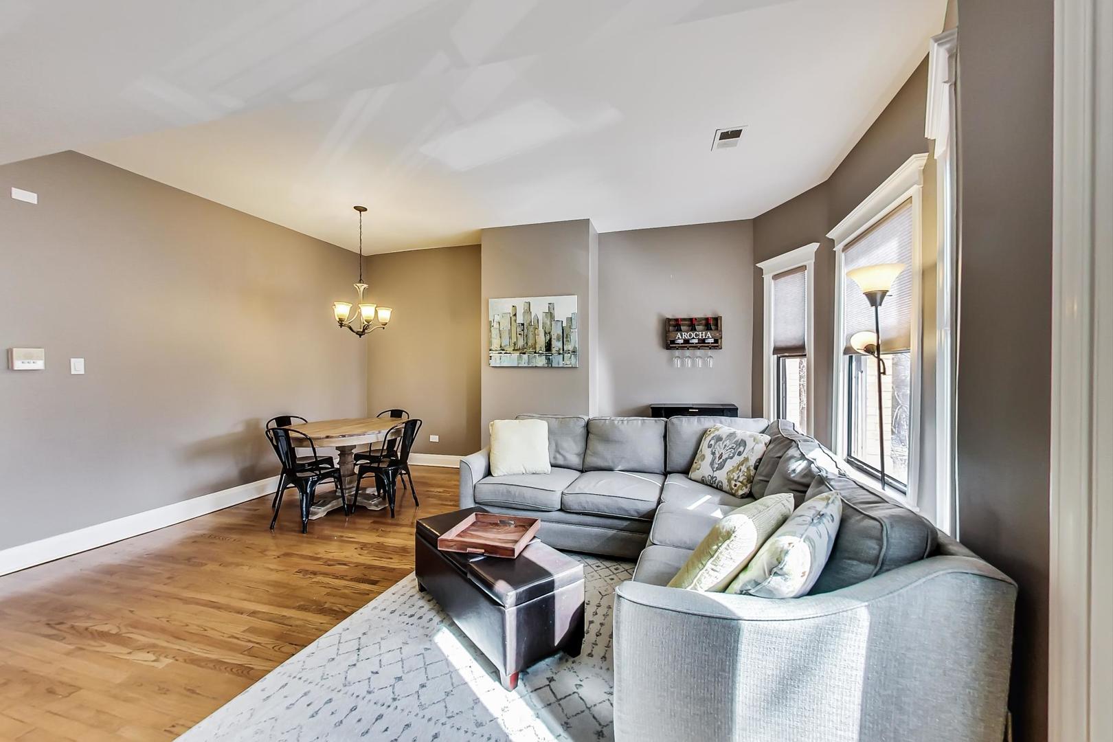 4214 North Kenmore Avenue, Unit 2F Chicago, IL 60613 - Photo 6 of 23 a living room with furniture and a table