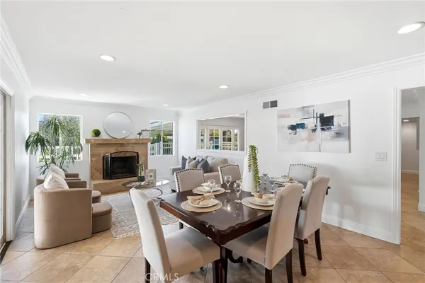a kitchen with kitchen island granite countertop a sink stove and refrigerator