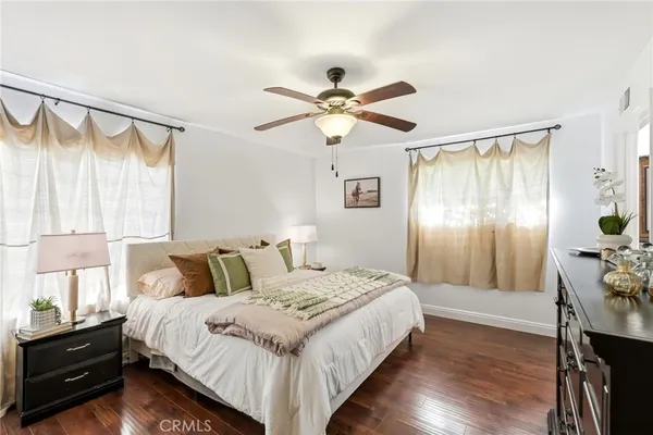 a bathroom with a granite countertop sink a mirror and a shower