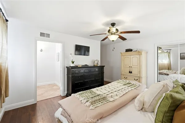 a bathroom with double vanity sinks and a mirror