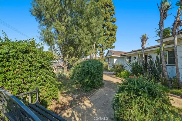 a swimming pool with outdoor seating and yard