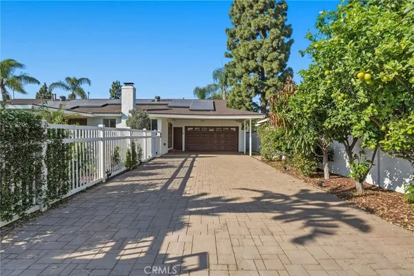 a outdoor dining space with furniture and front door