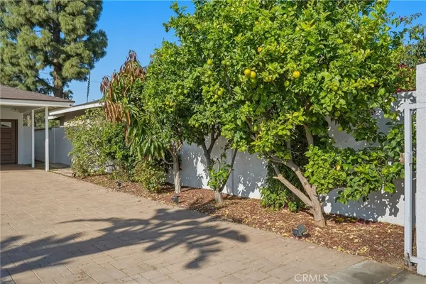 a view of a patio with a table and chairs
