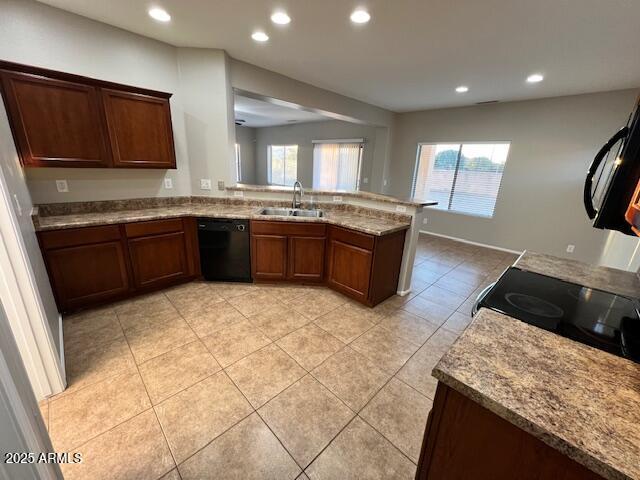 33578 North Sandstone Drive San Tan Valley, AZ 85143 - Photo 14 of 53 a large kitchen with granite countertop a stove a sink and a microwave
