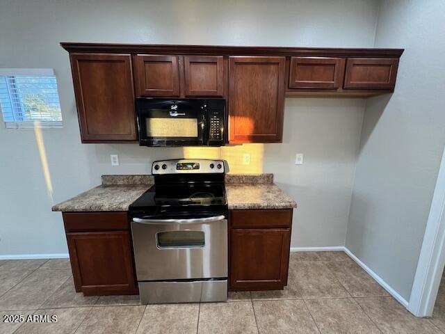33578 North Sandstone Drive San Tan Valley, AZ 85143 - Photo 16 of 53 a kitchen with wooden cabinets and a stove top oven