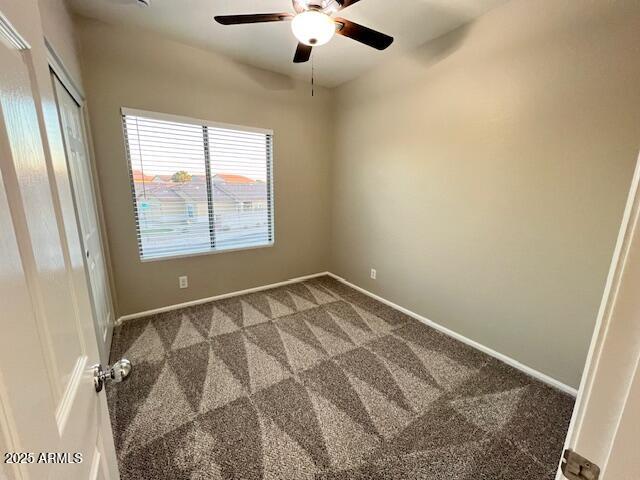 33578 North Sandstone Drive San Tan Valley, AZ 85143 - Photo 33 of 53 an empty room with a chandelier fan and windows