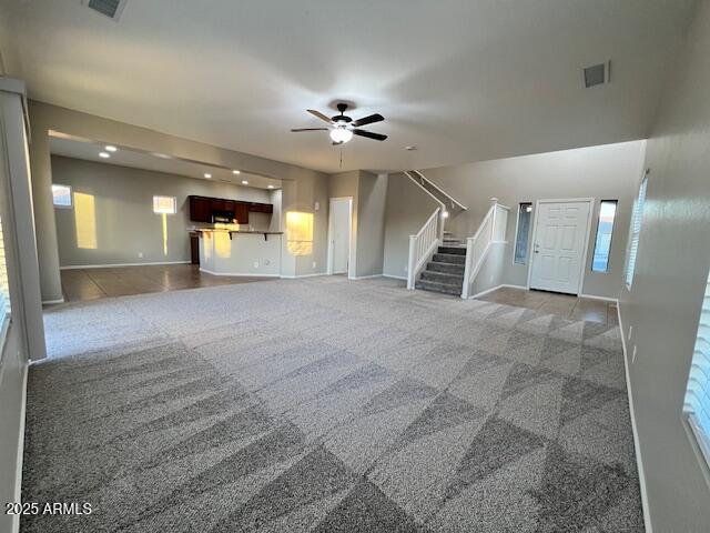 33578 North Sandstone Drive San Tan Valley, AZ 85143 - Photo 4 of 53 a view of a livingroom with a chandelier fan and windows