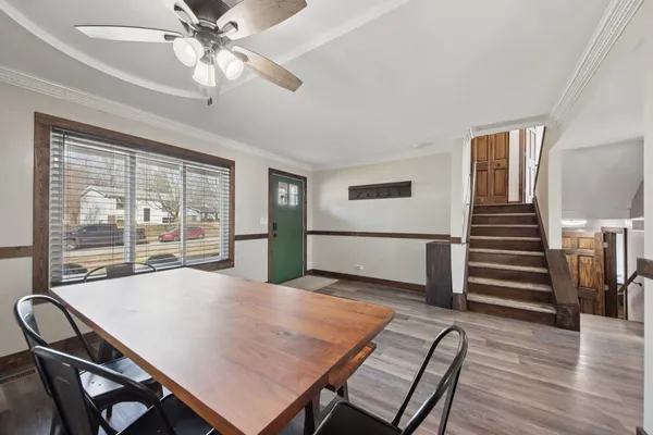 a view of a dining room with furniture window and wooden floor