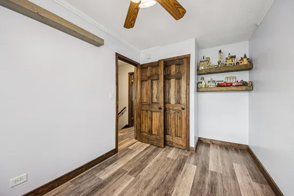 a view of front door with wooden floor