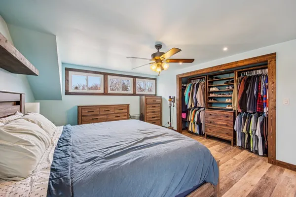 a bedroom with a bed and a walk in closet