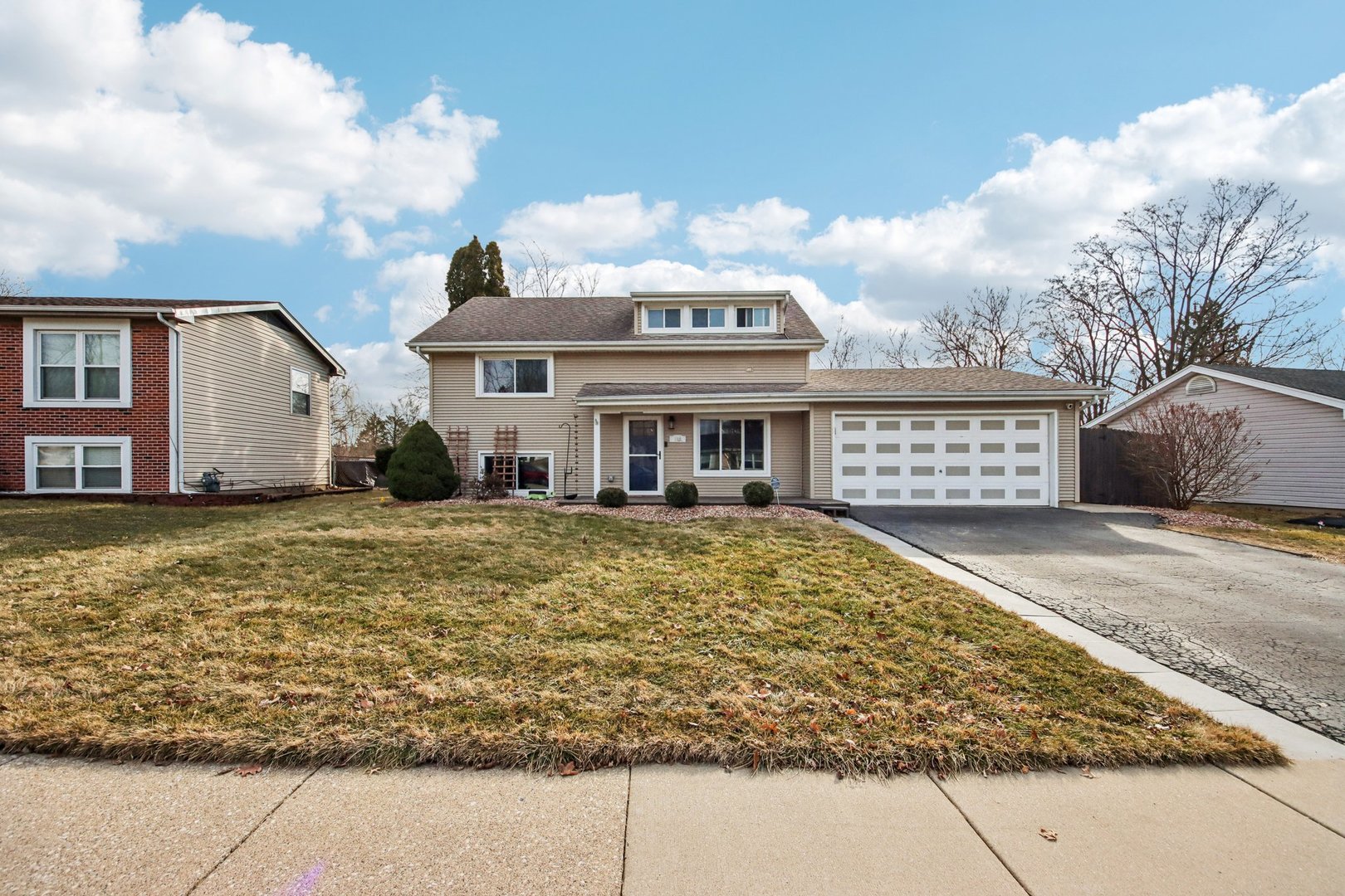 108 Davis Court Bolingbrook, IL 60440 - Photo 3 of 41 a front view of a house with a yard