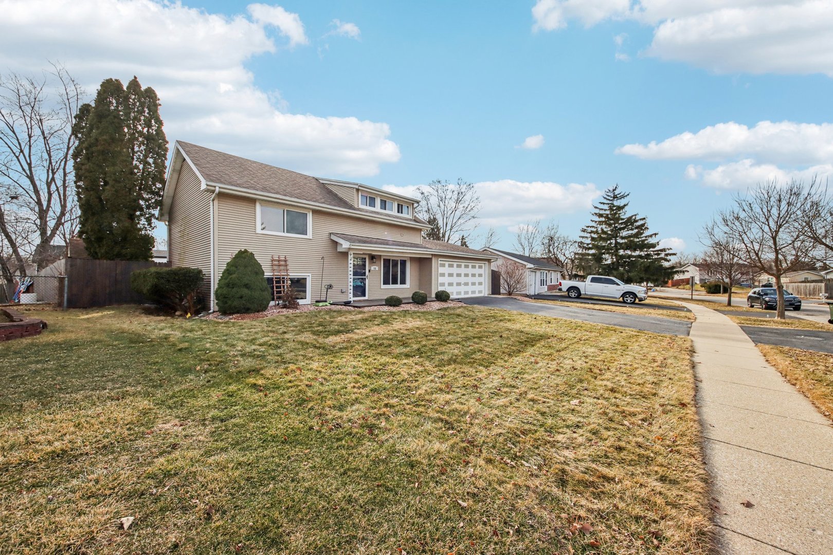 108 Davis Court Bolingbrook, IL 60440 - Photo 4 of 41 a house view with swimming pool and trees