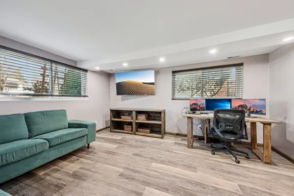 a workspace with furniture and a window