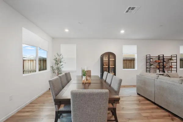 a dining room with furniture and window