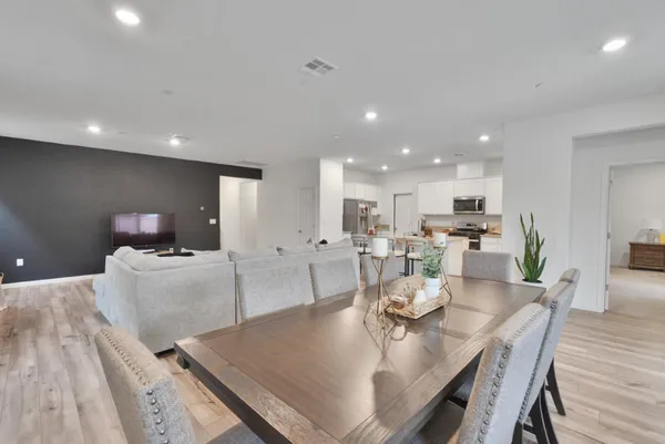 a living room with furniture and a table