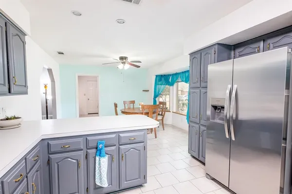 a kitchen with stainless steel appliances a refrigerator and a sink