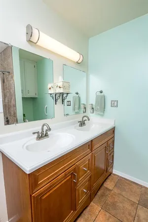 a bathroom with a sink and a mirror