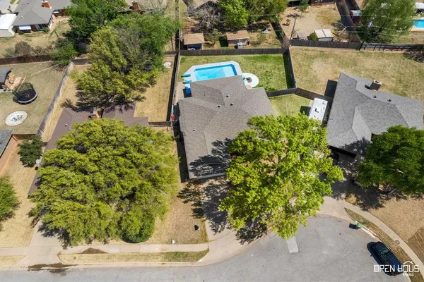 an aerial view of a house with a lake view
