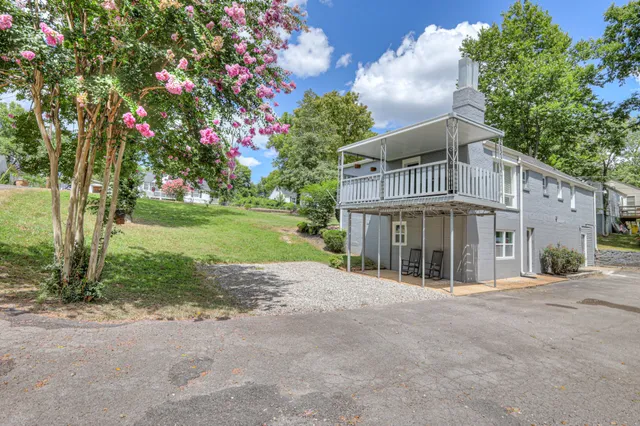 a front view of a house with a yard and a garage