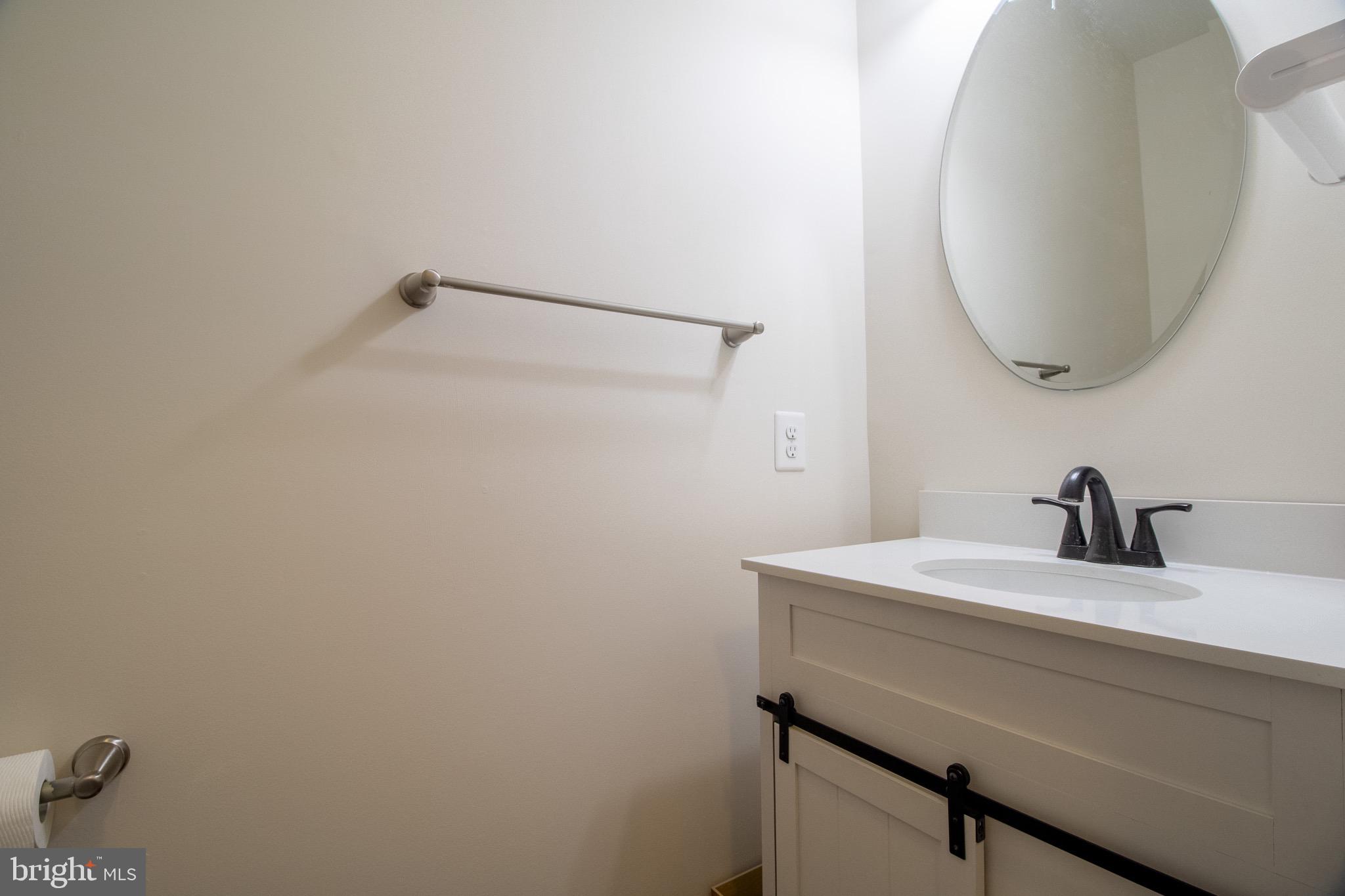 57 Tollerton Trail Falling Waters, WV 25419 - Photo 20 of 59 a bathroom with a sink and a mirror